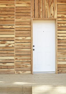 The first step to making plans for a $20K House available to builders is finding a design that work. Like the three $20K House projects built before theirs, the student team behind the Pattern Book House worked together to present a prototype of what such a home could look like. "There had been some community backlash to some of the previous prototypes," Grubb says. "We wanted to design something that the community would accept." To that end, they used a rain screen on the exterior walls to mimic siding on the area's traditional homes and chose cedar, as opposed to corrugated metal like other teams had done, so the locals could "compare it to a honey shed," Grubb adds.<br><br>Photo by <br><br>Ty Cole