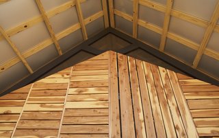 Grubb and her classmates designed a double-roof system for improved ventilation. The exaggerated overhang protects the home and its residents from the elements.<br><br>Photo by <br><br>Ty Cole