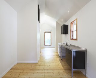 The Pattern Book House is a modest 292 square feet in size. "We were going for quality over quantity," Grubb says. "We were able to make it feel bigger than it is with the vaulted ceiling and the up-lighting."<br><br>Photo by <br><br>Ty Cole
