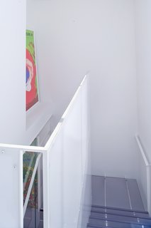 Samaha and Hart wanted to bring in as much light as possible and therefore created an operable skylight above the stairwell, which also provides natural ventilation. The view here is that from the master bedroom.<br><br>Photo by <br><br>Sharon Risedorph