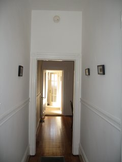Before the renovation, the house was composed of dark, discreet rooms that lacked connection to one another or the exterior. The view here is from the front door toward the back of the house.<br><br>Photo courtesy of Samaha + Hart Architecture