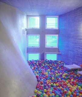 "I Live in a Steven Holl" - Photo 7 of 8 - The meditation-room-turned-ball-pit, illuminated by blue tinted windows.