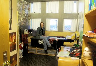 "I Live in a Steven Holl" - Photo 5 of 8 - Renee capitalizes on space by placing the modular drawers underneath the bed. However, this configuration precludes sunlight from entering the room via the lowest row of windows.