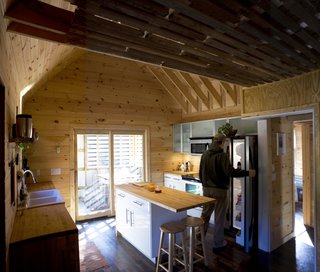 The kitchen, totaling an affordable $5,000 for all fixtures, refrigerator, stove, etc., came from Ikea. Image courtesy Chad Everhart Architect.