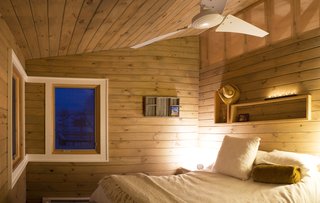 The corner window in the bedroom frames the view of one of three creeks and streams surrounding the two-and-a-half-acre site. Image courtesy Chad Everhart Architect.