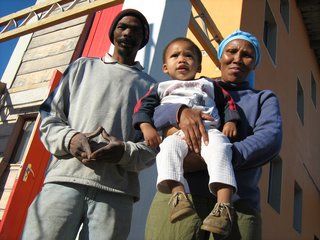 Artist Hans Jonkers, who previously lived in a shack with his wife, Olga, and six children, was initially wary of calling a house built of sand home. But once he understood the new building system, he was more than happy to move in through the cherry-red front door. Concrete, which is often made using sand as an aggregate, isn’t about to lose its status in South Africa any time soon, but for these first-time homeowners, sand in any other form is just as sweet. Image courtesy Interactive Africa/ Design Indaba