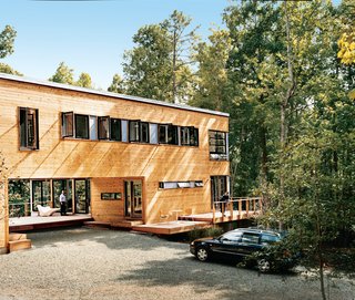 Wieler and Tung enjoy two of the home’s several decks.The home is clad in red cedar siding and features a multitude of view-enhancing windows by Loewen. The decking is composite wood by Trex.