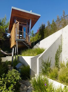 The tree house is perched on a hill that offers canyon vistas and views of downtown L. A. and the Getty Museum.