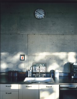 The kitchen countertops are covered in a thicker version of the same mild steel that clads the house and coated with beeswax to protect from scratches and stains.