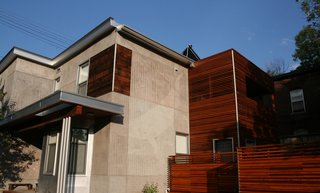 Griffin carved a humpback whale into the west elevation, which he dedicated to the sea. A new, aluminum-framed overhang adds a linear element and plays off of the house’s original floorboards employed as accent cladding, near the top.
