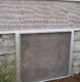 Instead of removing the old coal chute, Griffin printed the original deed to the property on a new concrete panel covering it.