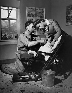 Dentist Making an Extraction. Questa, New Mexico, 1943. By John Collier Jr., image courtesy The American Image.