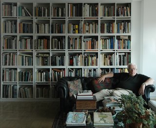 Unpacking My Library - Photo 1 of 4 - Architect Peter Eisenman reclines at home surrounded by his 1,000-book library of his own design.