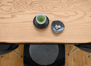 Small Box Home with Black Metal Facade in Japan - Photo 7 of 14 - Green tea and a sweet for a guest.