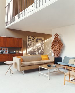 The Wegner CH22 was donated to the home by Joyce and Richard Opdahl. A huge axonometrical rendering by Philo Jacobson hangs in the background.