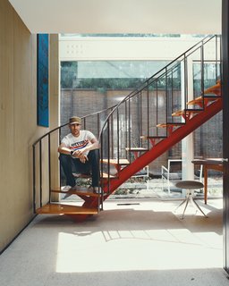 Below a twisting steel staircase sits a stool from the impossibly rare 1967 Girard Group for Herman Miller (it was only produced for one year). Stevens rennovated the home from top to bottom, including the Japanese-style fence in the garden.