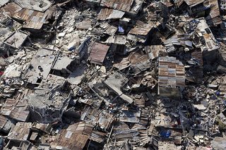 Rebuilding Haiti - Photo 1 of 1 - An aerial view of an impoverished neighbourhood in Port-au-Prince demonstrates the extent of damage inflicted by the powerful earthquake that rocked the Haitian capital on 12 January.<br><br>13/Jan/2010. Port-au-Prince, Haiti. UN Photo/Logan Abassi. www.un.org/av/photo/