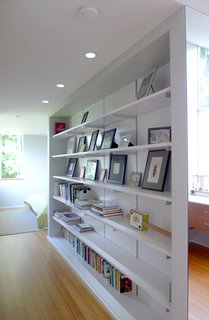 Bedroom Addition in Seattle - Photo 15 of 16 - The bookcase delineates the two areas.
