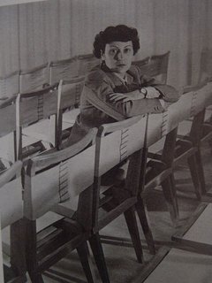 The architect with her side chair designs, year unknown. Photo courtesy Espasso.