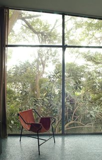 Bo Bardi designed the Tripé, or Tripod, armchair, around 1948. Made of painted tubular metal and hand-stitched leather and possessing the same design principles as the hammock, several examples existed throughout the Glass House. Photo courtesy Espasso.