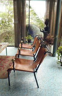 The leather sling and ball motif of the dining chairs were repeated in other Bo Bardi designs. Photo courtesy Espasso.