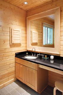 Campbells' Coup - Photo 6 of 12 - A discreet master bathroom eliminates visual clutter.