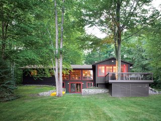 Campbells' Coup - Photo 9 of 12 - The rise of the front lawn and the height of the trees give the house a subtle presence amid magnificent surroundings.