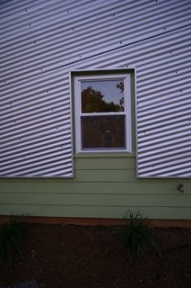 Because the team chose to orient the house along the north-south axis, they limited the number and size of windows on the east and west elevations to reduce heat gain. Photo courtesy of Jared Boudreaux and Tim Hayes.