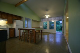 The left side of the house is the main public area and was designed as a kitchen-dining-living great room. Photo courtesy of Jared Boudreaux and Tim Hayes.
