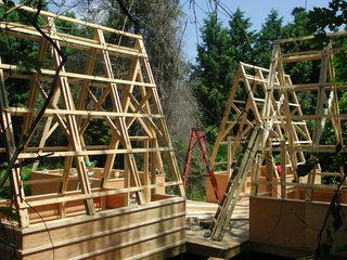 The shape of the prefabricated trusses was inspired by sails and Moskow's father-in-law's love for boating. The collection of shelters is reminiscent of days past when groups of covered wagons traveled West.