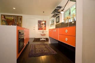 The original white-oak floors were continued into the kitchen and ebonized throughout the apartment.