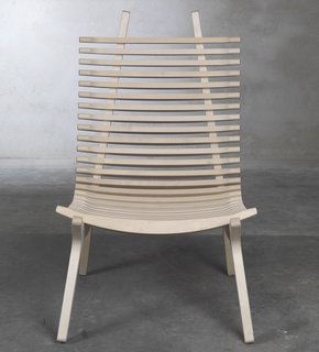 Stockholm Furniture Fair 2010 - Photo 5 of 22 - The IBBI lounge chair by designer Nils Gulinis features two distinct parts— Mirror-image frame supports, which give the chair shape, and 29 sculpted laths that cradle the body, providing the chair with beautiful lines from every perspective. IBBI also has a thin seat pad for comfort, and a headrest available.