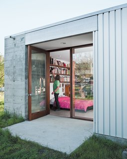 25 Modern Homes That Kill it With Concrete - Photo 25 of 25 - Nestled in an apple grove in Sebastopol, California, the Orchard House is a rural idyll. And with the voracious design appetites of a family of gastronomically inclined clients, this concrete prefab construction is quite literally a moveable feast of a home.