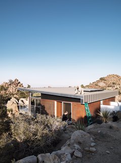 Small "Hybrid Prefab" Home in the Desert - Photo 9 of 10 - As a paean to the old steel-mining shacks that inspired the home, McAdam sprayed the the corrugated-steel exterior with apple cider vinegar to create a warm rust effect.
