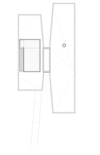 The retreat, which was manufactured by Kullman Buildings (founded in 1927 for the purpose of building prefab steel-and-glass diners), takes on an X formation, with one end of the X equipped with floor-to-ceiling glass windows overlooking the water. "It’s quite a bucolic site," says Garrison. "We related the building to both the lake and the gentle slope of the land, and created an opening in the center of the X that makes the building seem larger and allows reflective light in."
