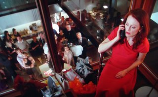 Here Egoyan captures Catherine Stewart (Julianne Moore) through the various glass planes in the house. A sense of hovering doom pervades the film; only bad things happen once you get upstairs.