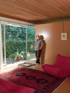A sliding glass door and breezy cross ventilation make Louis Molina’s modest living room appear more generous than its actual dimensions.
