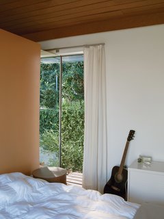 The bedroom offers just enough space for a bed and nightstand.