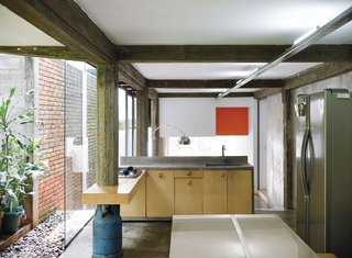 A kitchen that opens onto the garden is the complete antithesis of Jakarta’s often dim and dingy suburban interiors.