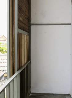 Here's a look at the other side of the sliding panel on the street-facing facade. The materials of the house were sourced locally so a good bit of Indonesian timber went into the house.