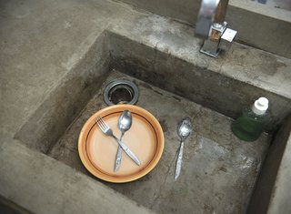 Concrete stands up quite well to Jakarta's sultry climes, and it does pretty well against dirty dishes as well.