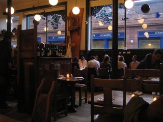 The picture is a bit dim, but here's a snap of Cafe Gandolfi. I love the stained-glass fish in the window as well.