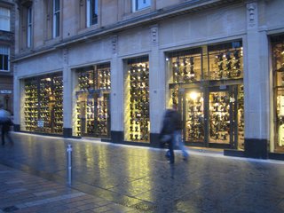On my walk home tonight I passed the All Saints clothing store on Buchanan Street. Hung in the many windows are scores upon scores of vintage sewing machines which form a kind of porous industrial curtain. The best retail design I've seen yet in Scotland.