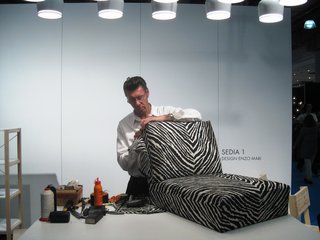 ICFF 2010: Dressing Up with Artek - Photo 6 of 6 - At the ICFF in New York, Aki Lehtonen, a veteran employee of Artek, puts the finishing touch on an Aalto Armchair 400.