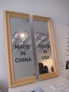 Uncomfortable Conversations - Photo 3 of 7 - Chi-Merica by Paul Loebach. This mirror represents the divide between American-made products and those produced in China.