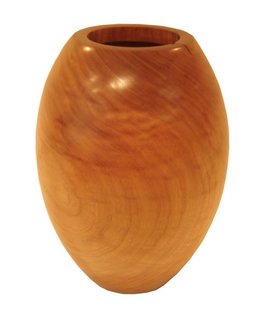 Etel Carmona creates her Bojudo vase (which roughly translates to "rounded") from the trunks of fallen native Brazilian trees. In each vase, as in this cedar example, Carmona celebrates the natural cracks and grain of the wood, resulting in one-of-a-kind pieces.