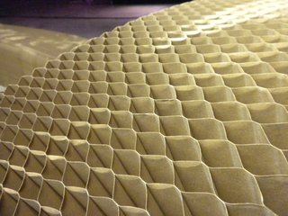 Despite the thinness of the kraft paper used in the Soft collection, it handily holds a seated adult due to its use of a honeycomb structure to distribute the weight.