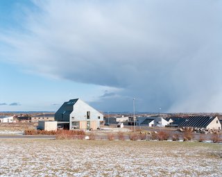 The Active House sits on a sloping plot on the outskirts of Aarhus, Denmark, with views to the south over the sea.