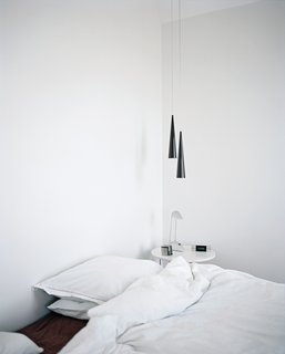 An upstairs bedroom is at once bright and cozy.