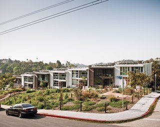 Seven town homes, with slivers of air between them, possess the appearance and energy-saving advantages of row houses.